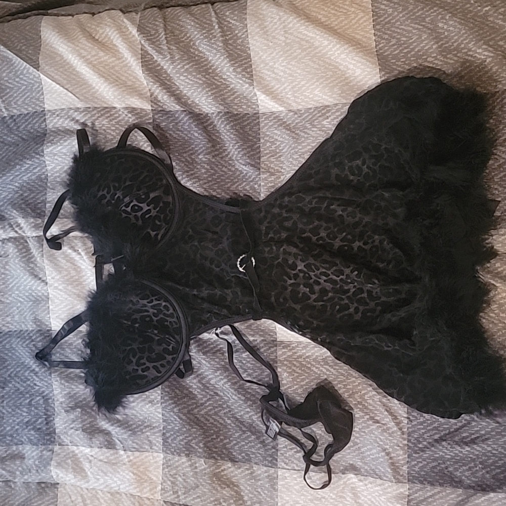 Black leopard print apron. With feathers.